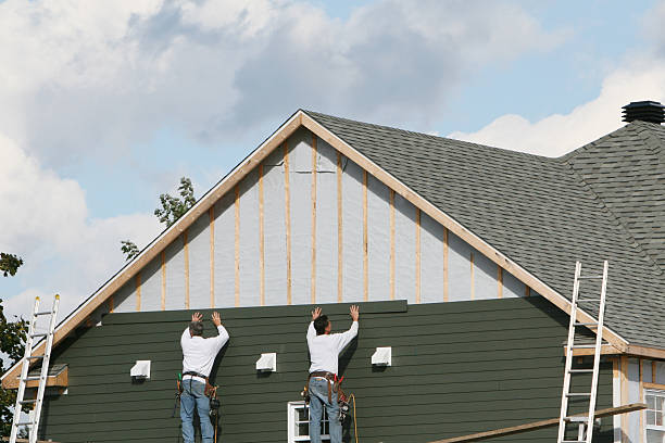 Professional Siding Replacement technician working in Springs, NY